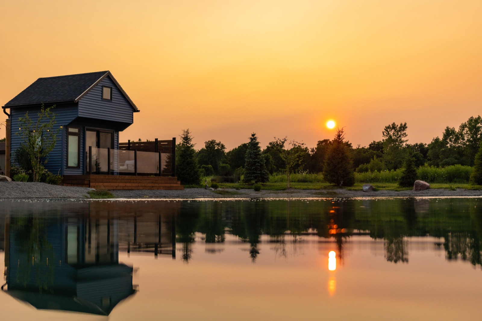 Panoramic sunset reflection over the pond