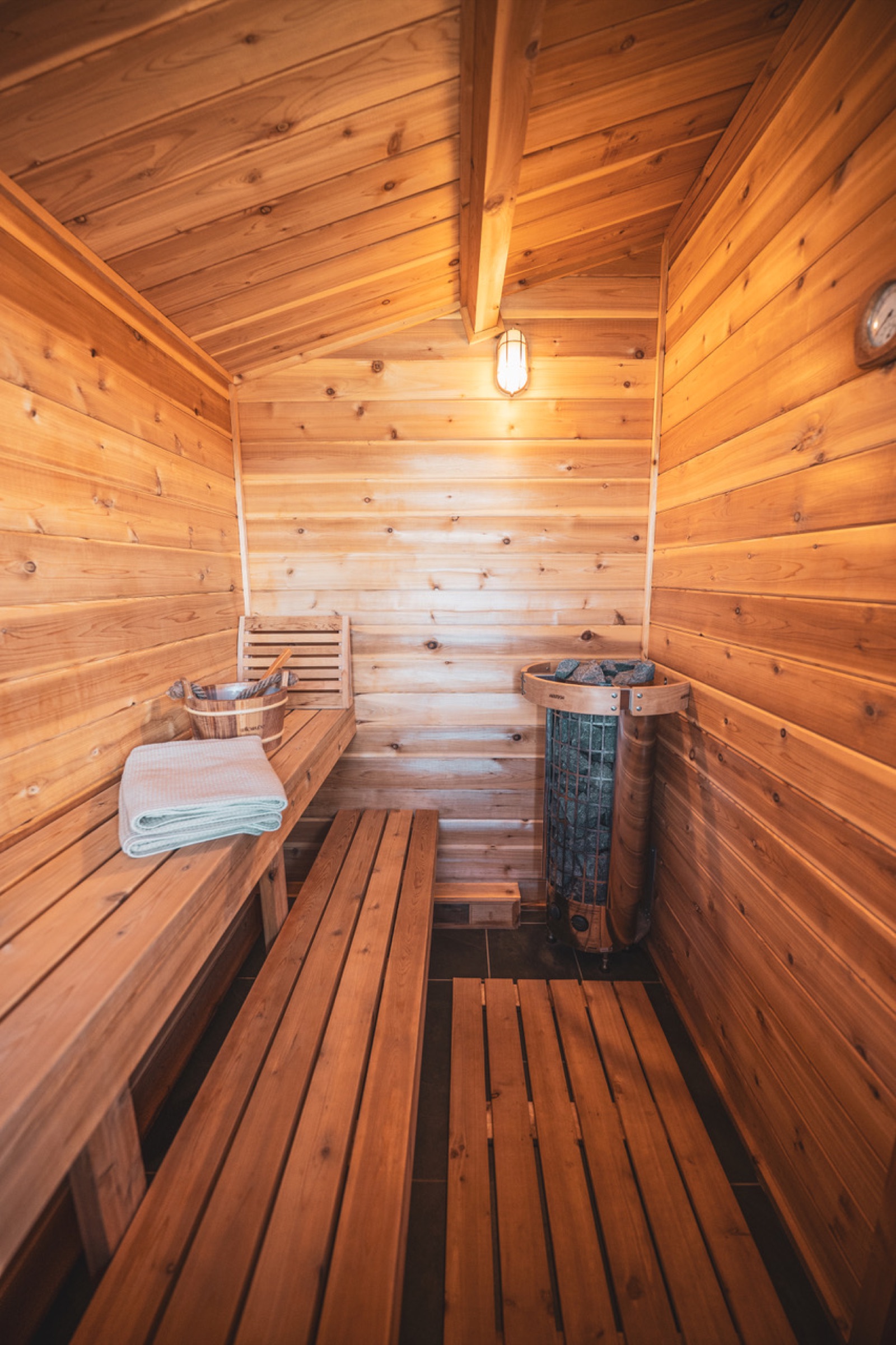 Interior of the cedar sauna with wooden benches